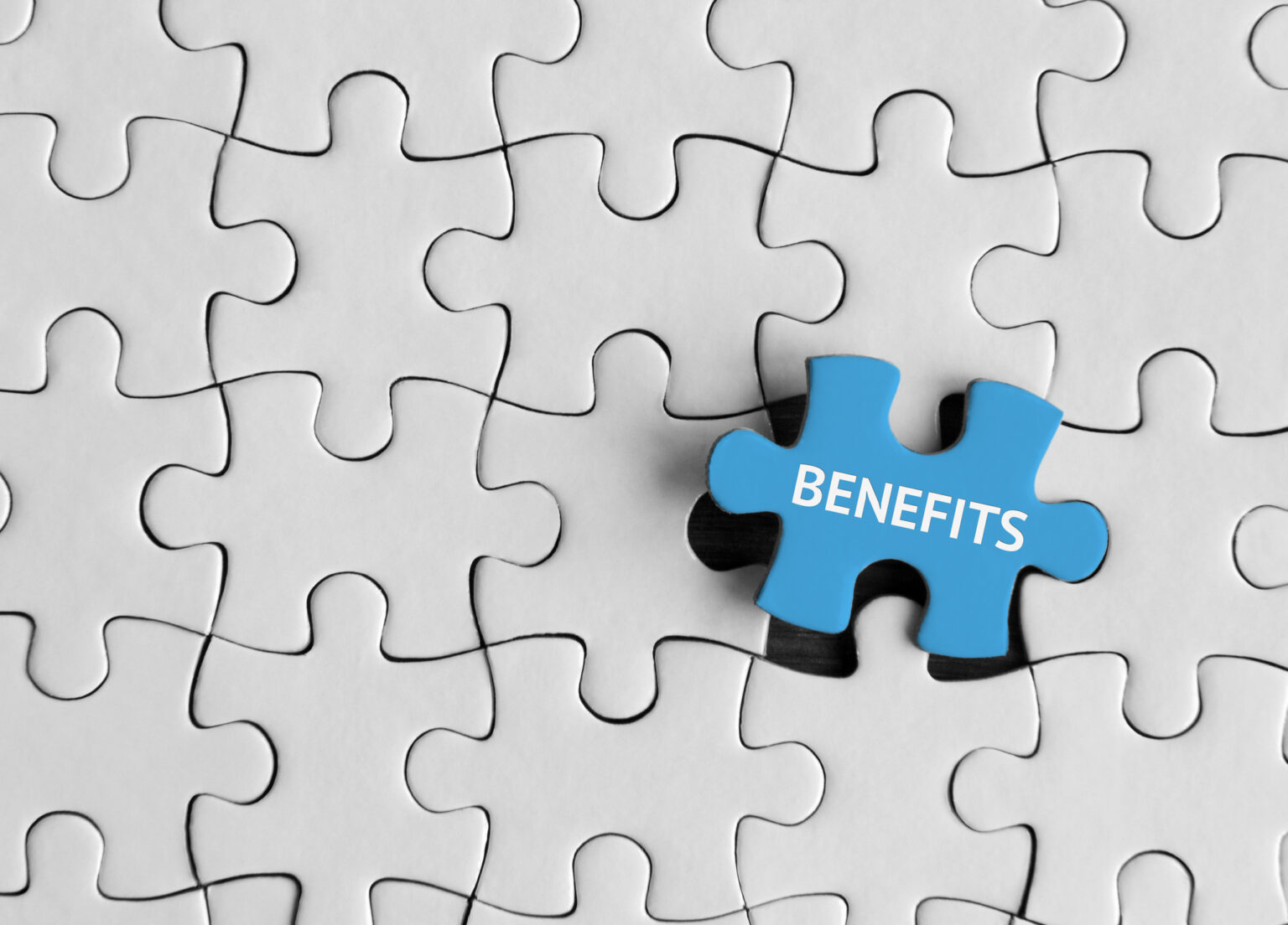 Image of puzzle piece with word "benefits" on it