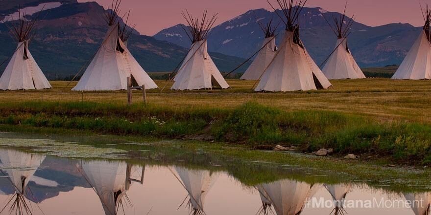 stock photo of tipis by a river