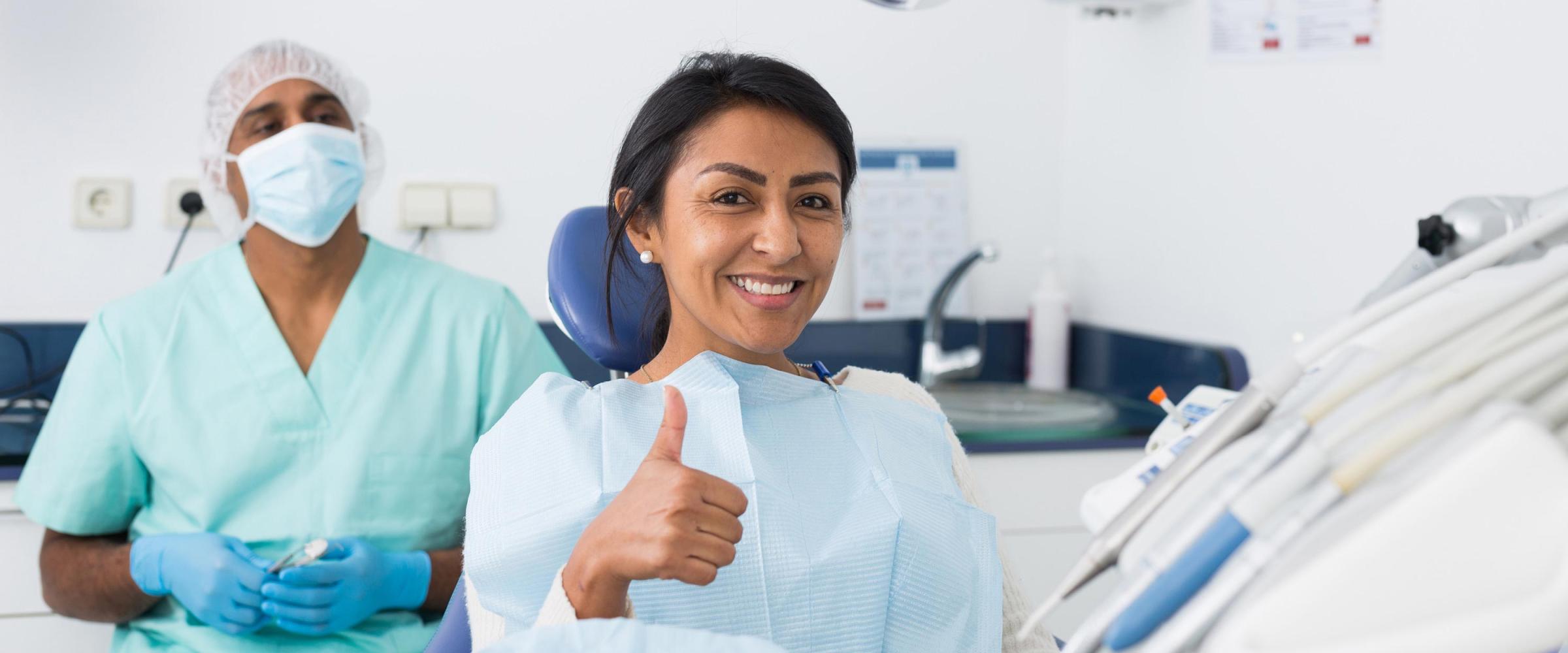 Photo of a woman smiling in the dentist's chair