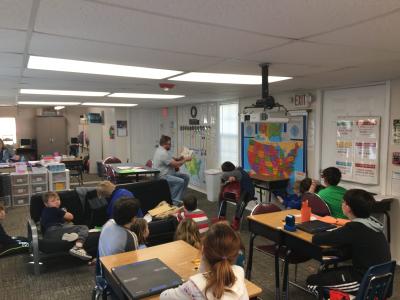 Image of supervisor and young children in a daycare