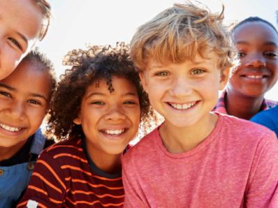 children smile for the camera