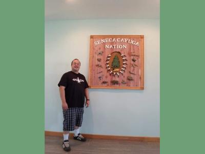 image of will tarrant next to SCN sign