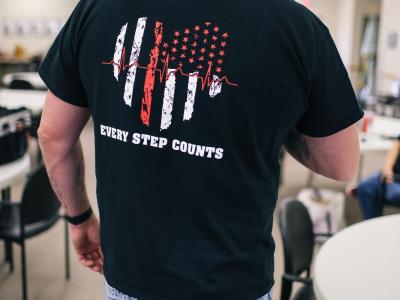 mike kerr in t-shirt that says "every step counts"