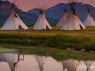 stock photo of tipis by a river